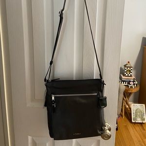 NWT, TUMI, Canon Crossbody. Color is IRON GRAY. 10.5x10.25x2 In stores for $275